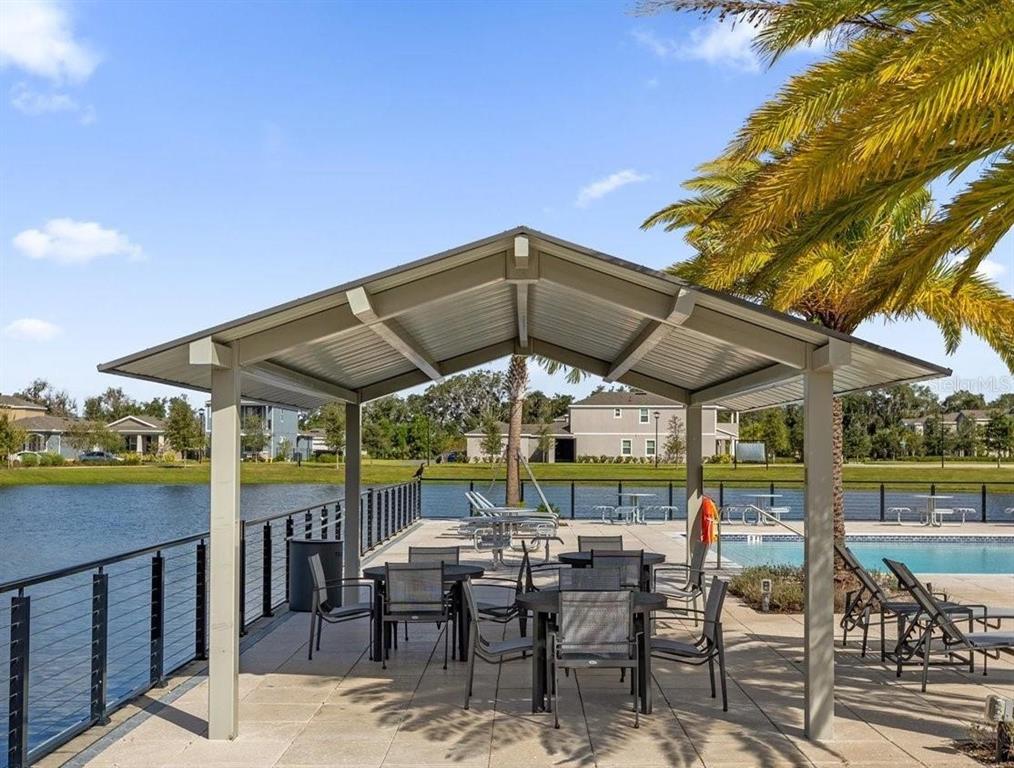 744 Hyperion Drive DeBary, FL 32713 - Photo 51 of 54 an outdoor space with furniture and umbrella