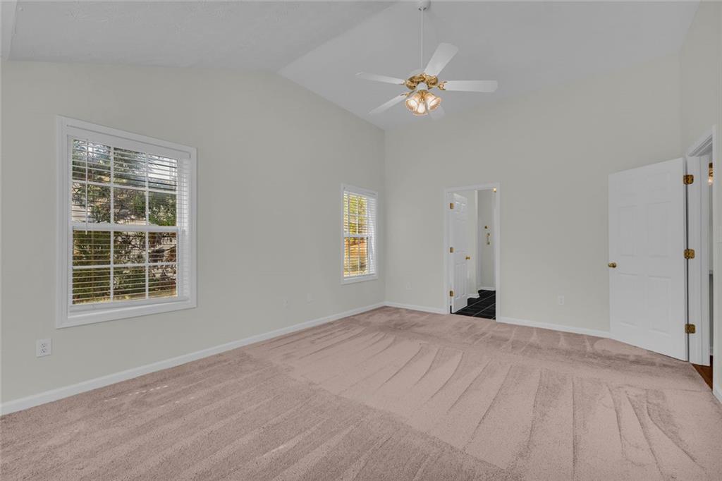 201 Wisteria Way Athens, GA 30606 - Photo 13 of 38 a view of a big room with windows and chandelier fan