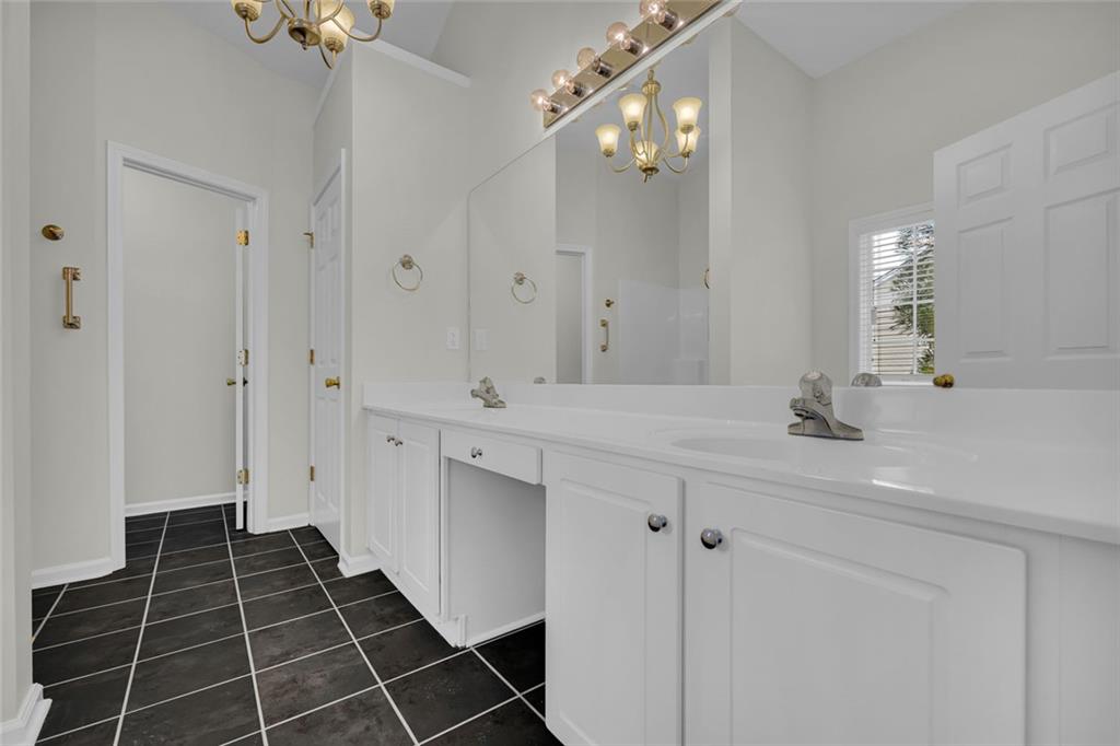 201 Wisteria Way Athens, GA 30606 - Photo 14 of 38 a bathroom with a double vanity sink mirror and shower