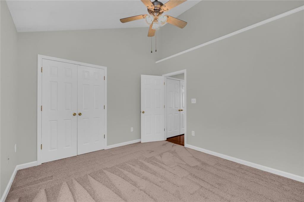201 Wisteria Way Athens, GA 30606 - Photo 19 of 38 a view of a room with a ceiling fan and a window