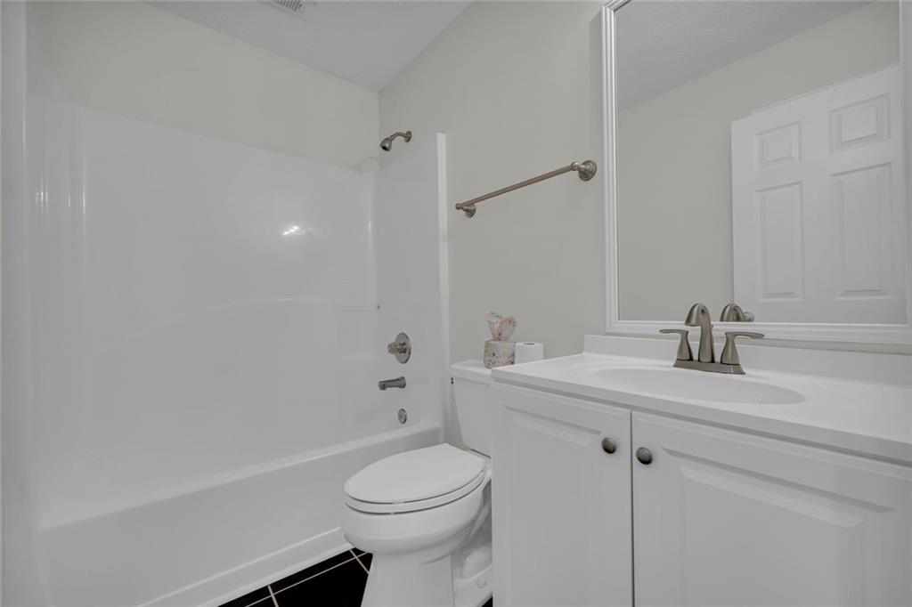 201 Wisteria Way Athens, GA 30606 - Photo 20 of 38 a bathroom with a sink a toilet and shower