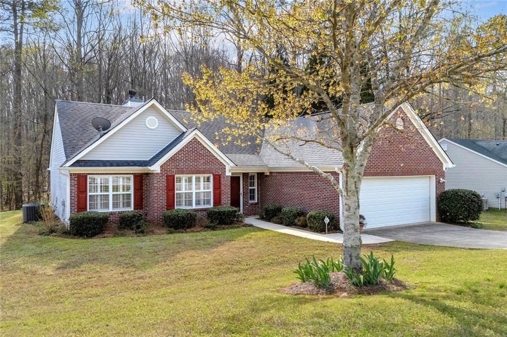 201 Wisteria Way Athens, GA 30606 - Photo 2 of 38 a front view of a house with a yard