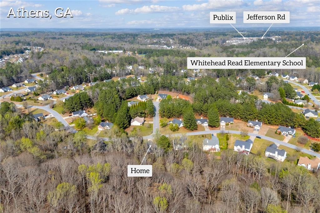 201 Wisteria Way Athens, GA 30606 - Photo 37 of 38 a view of a water with a building in the background