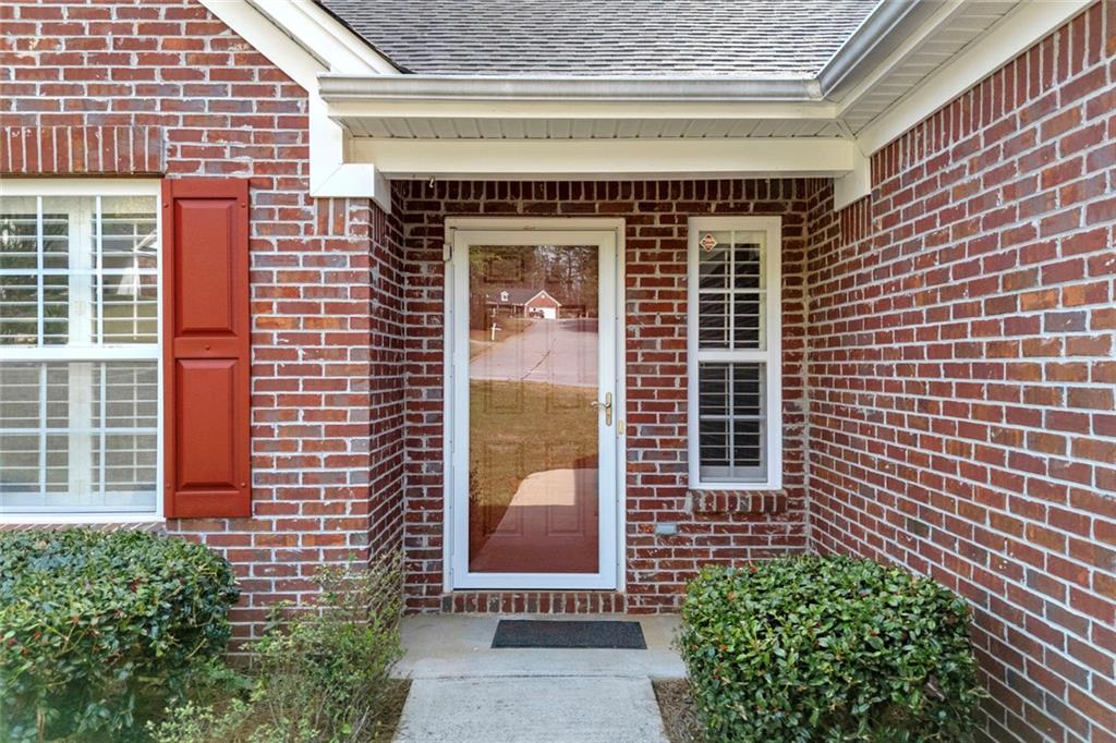 201 Wisteria Way Athens, GA 30606 - Photo 4 of 38 a front view of a house with a garden