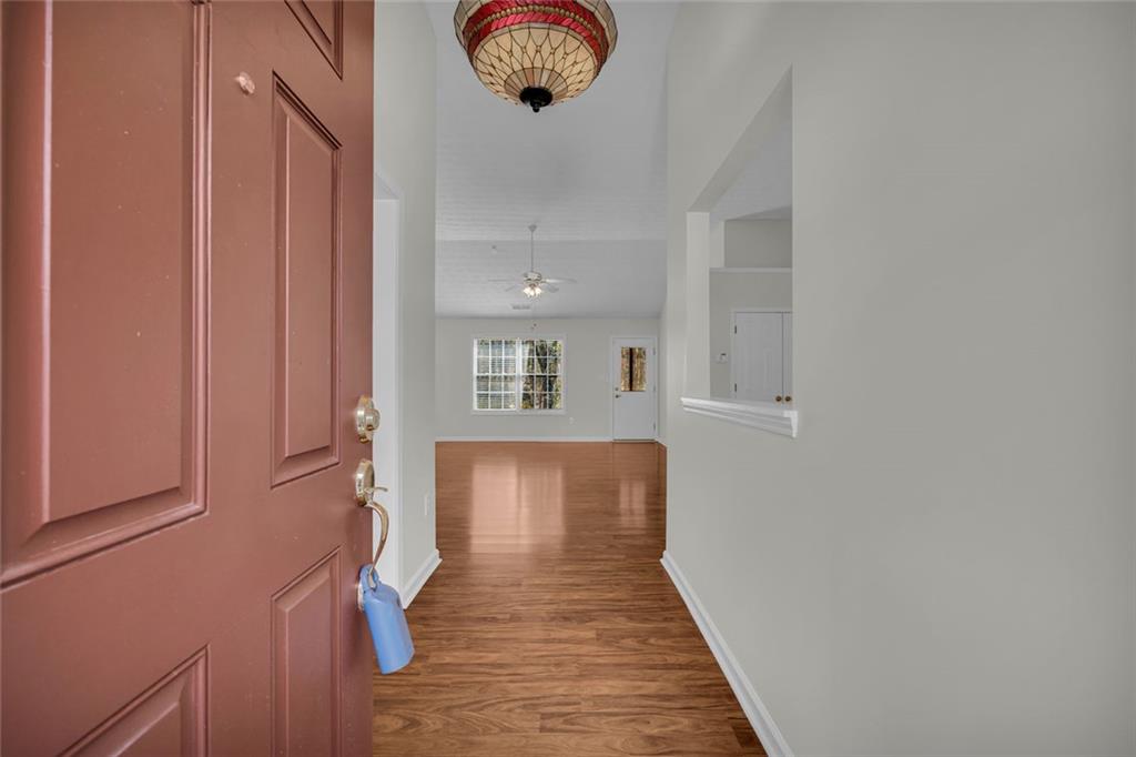 201 Wisteria Way Athens, GA 30606 - Photo 5 of 38 a view of a hallway with wooden floor and staircase