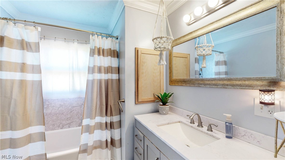 3659 Morrow Road Kent, OH 44240 - Photo 20 of 39 Bathroom featuring a vanity with an integrated sink, broad mirror, and overhead lighting