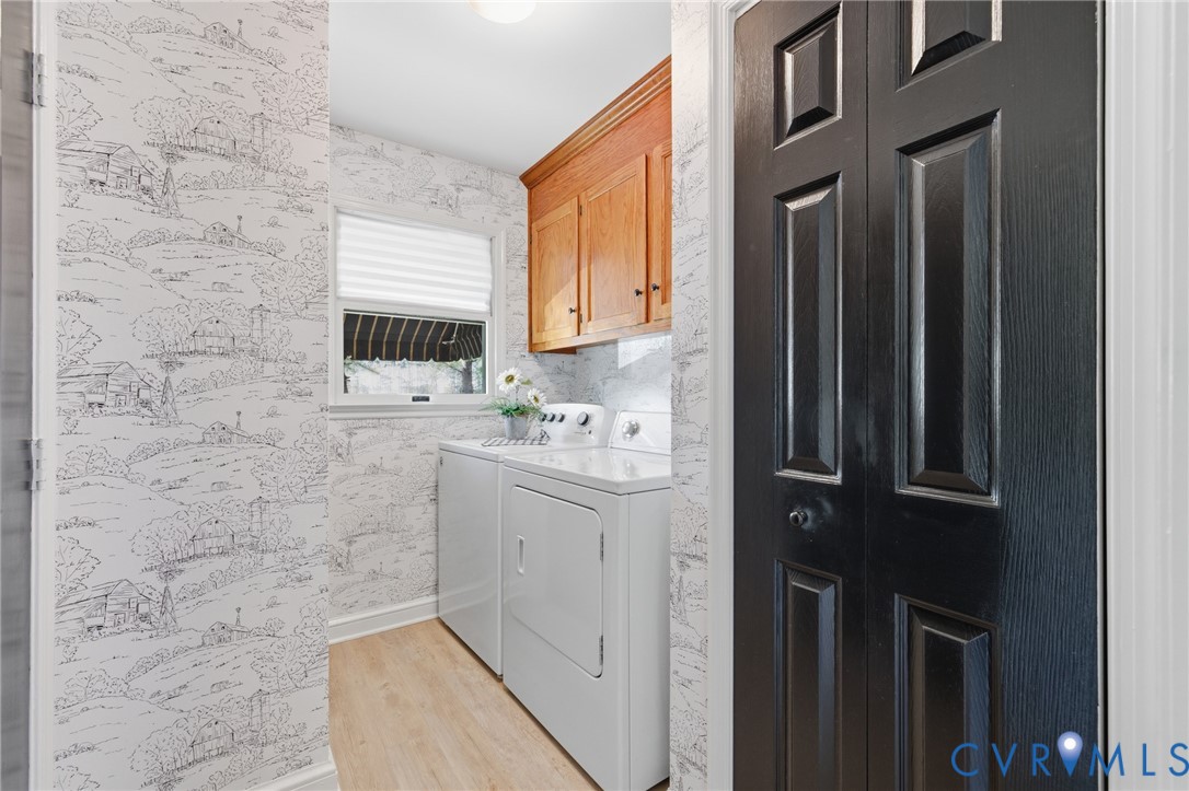 6606 West Quaker Road Disputanta, VA 23842 - Photo 18 of 32 Laundry room with LVP flooring, 2 closets