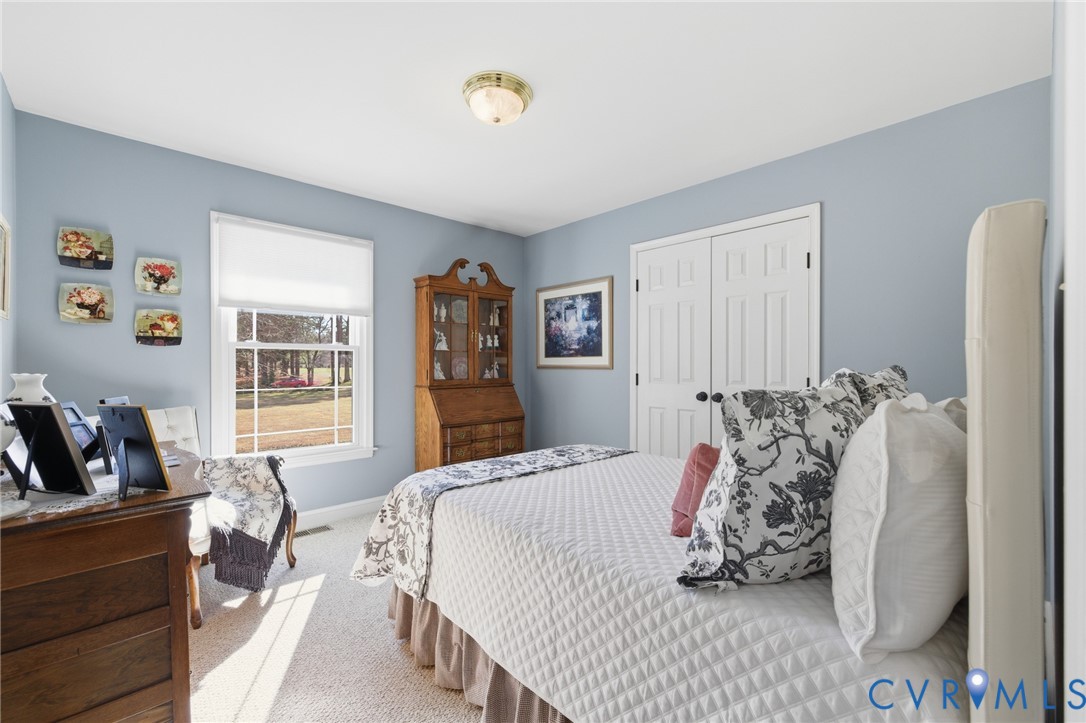 6606 West Quaker Road Disputanta, VA 23842 - Photo 19 of 32 Bedroom with carpet flooring and a closet