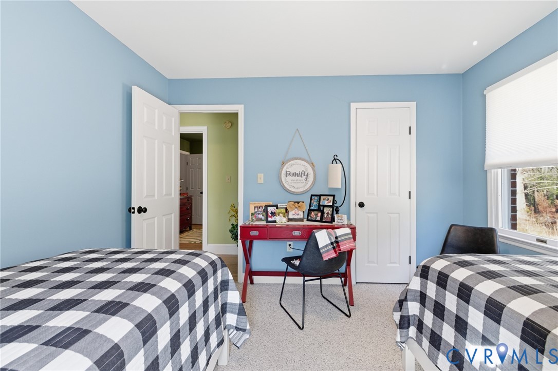 6606 West Quaker Road Disputanta, VA 23842 - Photo 22 of 32 Bedroom featuring light carpet and baseboards