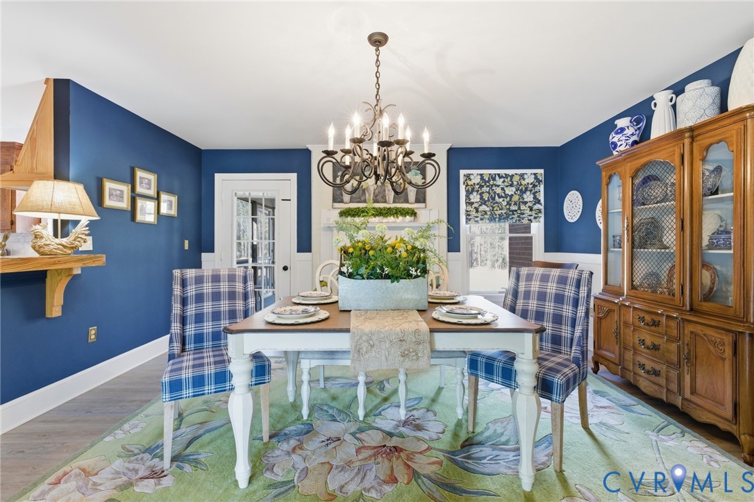 6606 West Quaker Road Disputanta, VA 23842 - Photo 9 of 32 Dining space w/gas fireplace, LVP flooring, opens