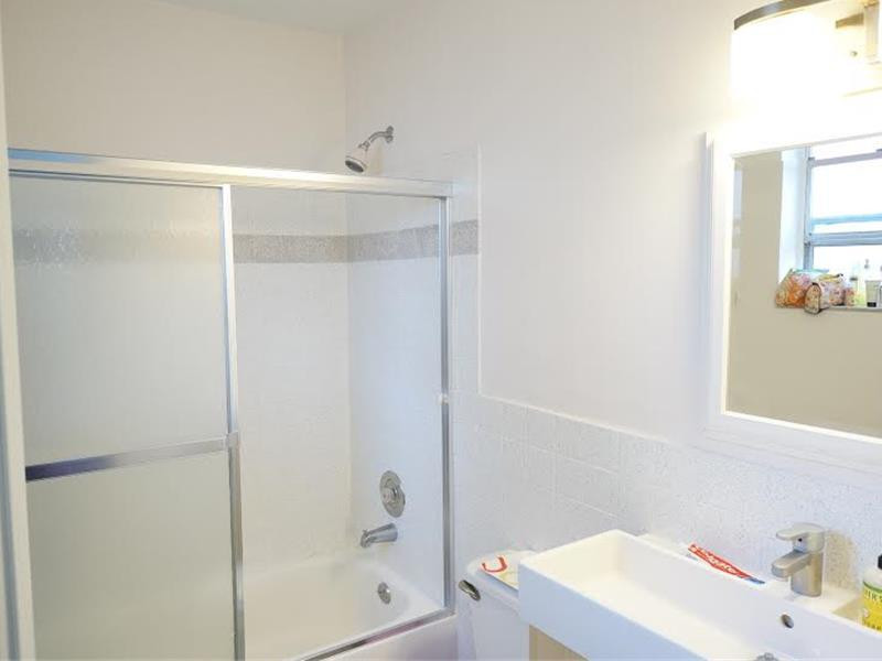 9293 Southampton Place Boca Raton, FL 33434 - Photo 11 of 12 a bathroom with a sink a toilet and shower