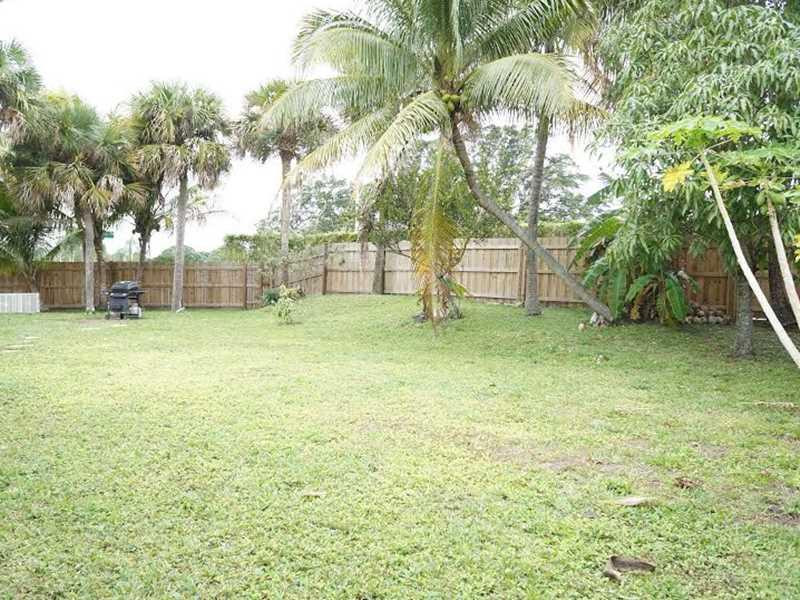 9293 Southampton Place Boca Raton, FL 33434 - Photo 3 of 12 a view of a yard with a tree