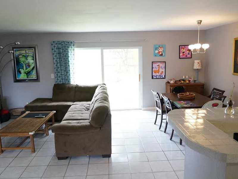 9293 Southampton Place Boca Raton, FL 33434 - Photo 5 of 12 a living room with furniture and a window