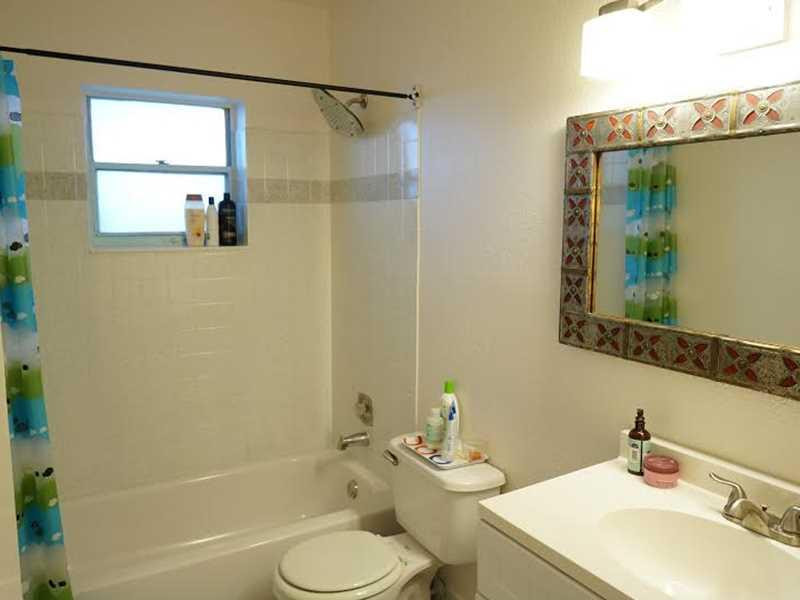 9293 Southampton Place Boca Raton, FL 33434 - Photo 10 of 12 a bathroom with a sink toilet and shower