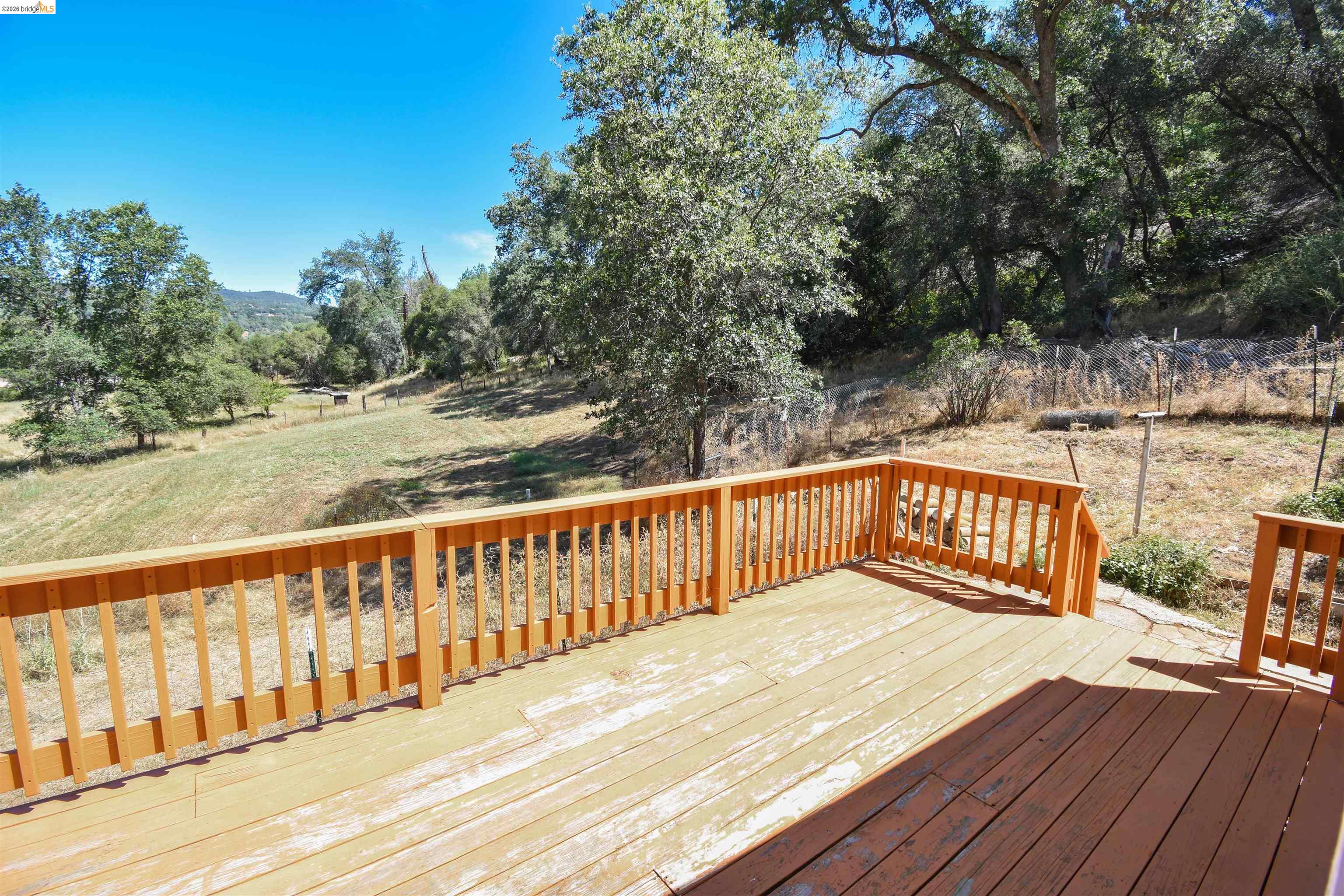 13904 Tuolumne Road Sonora, CA 95370 - Photo 28 of 44 Expansive wood deck with a full railing system