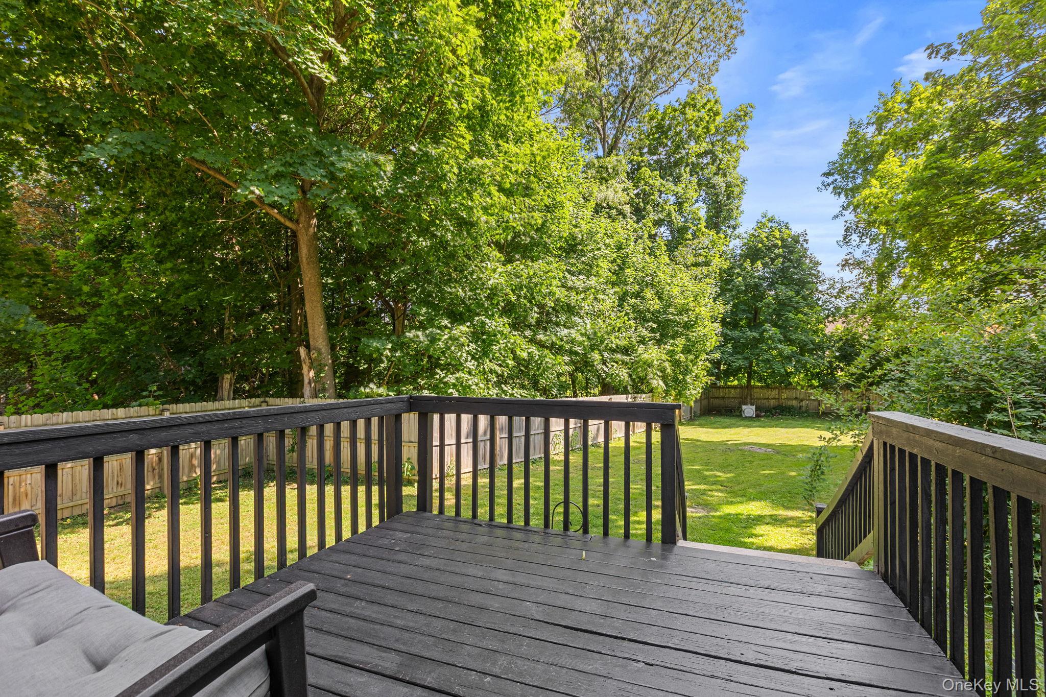 10 Batavia Road Patterson, NY 12563 - Photo 25 of 42 Spacious wooden deck with dark finish