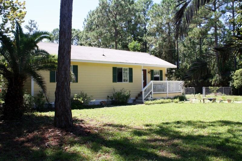 53 Mandy Circle Santa Rosa Beach, FL 32459 - Photo 1 of 13 a view of a house with backyard porch and sitting area