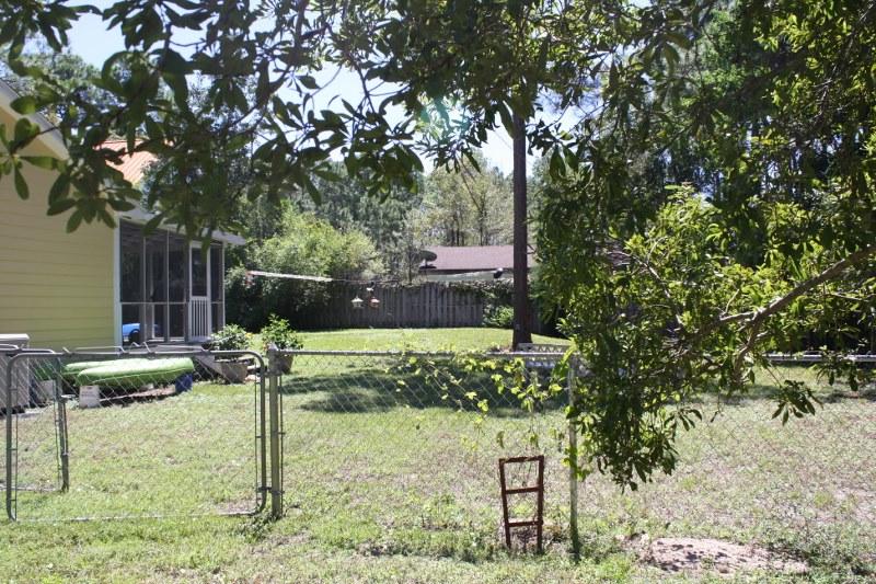 53 Mandy Circle Santa Rosa Beach, FL 32459 - Photo 3 of 13 a backyard of a house with lots of green space