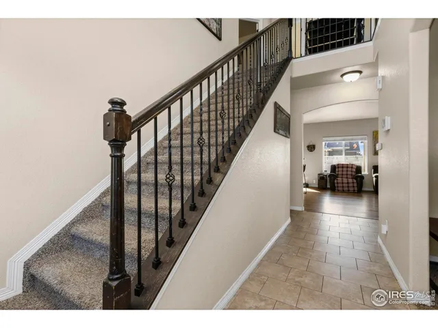 a view of a hallway view with staircase