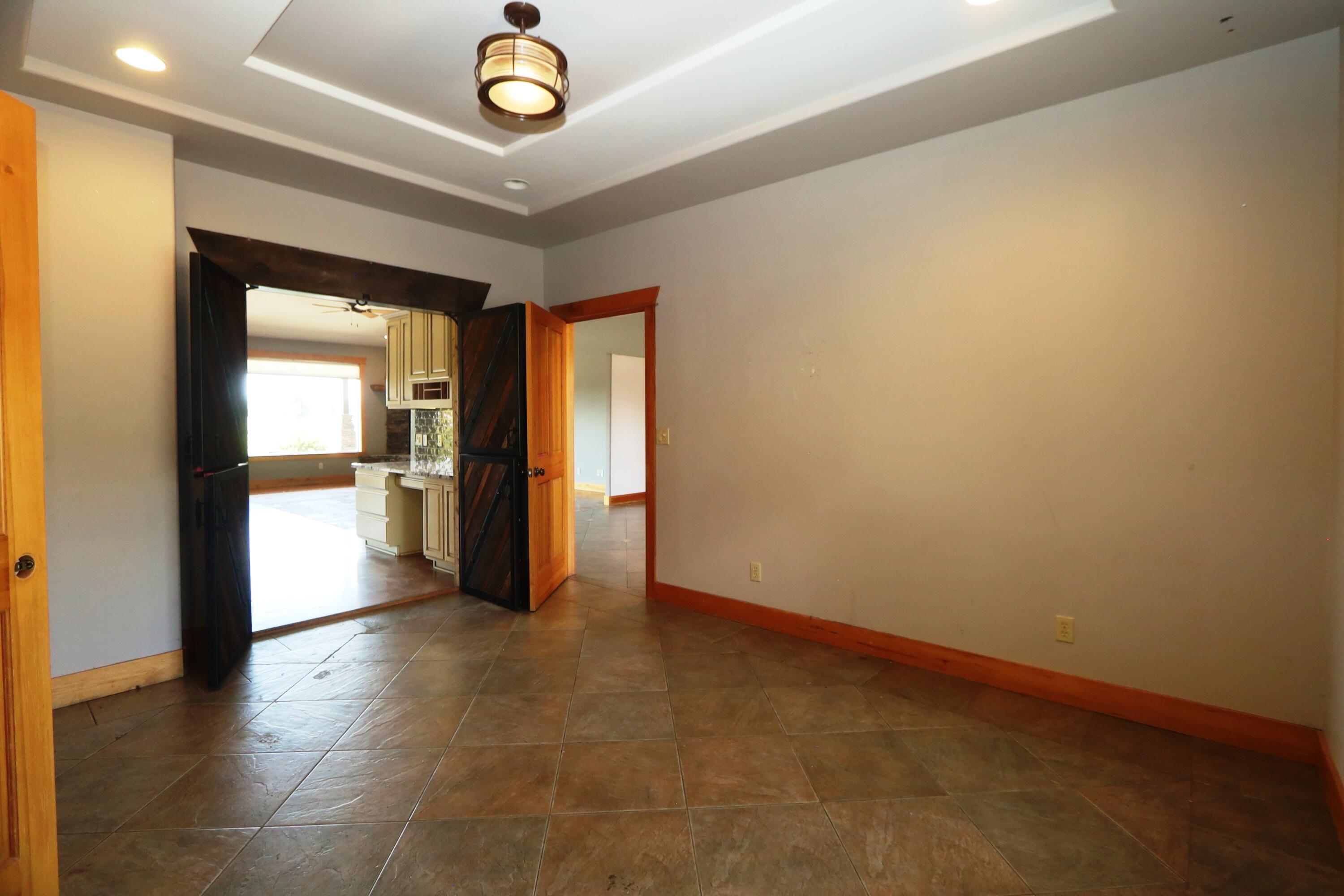 21491 Bear Creek Road Bend, OR 97701 - Photo 16 of 45 wooden floor in a hall with an entryway
