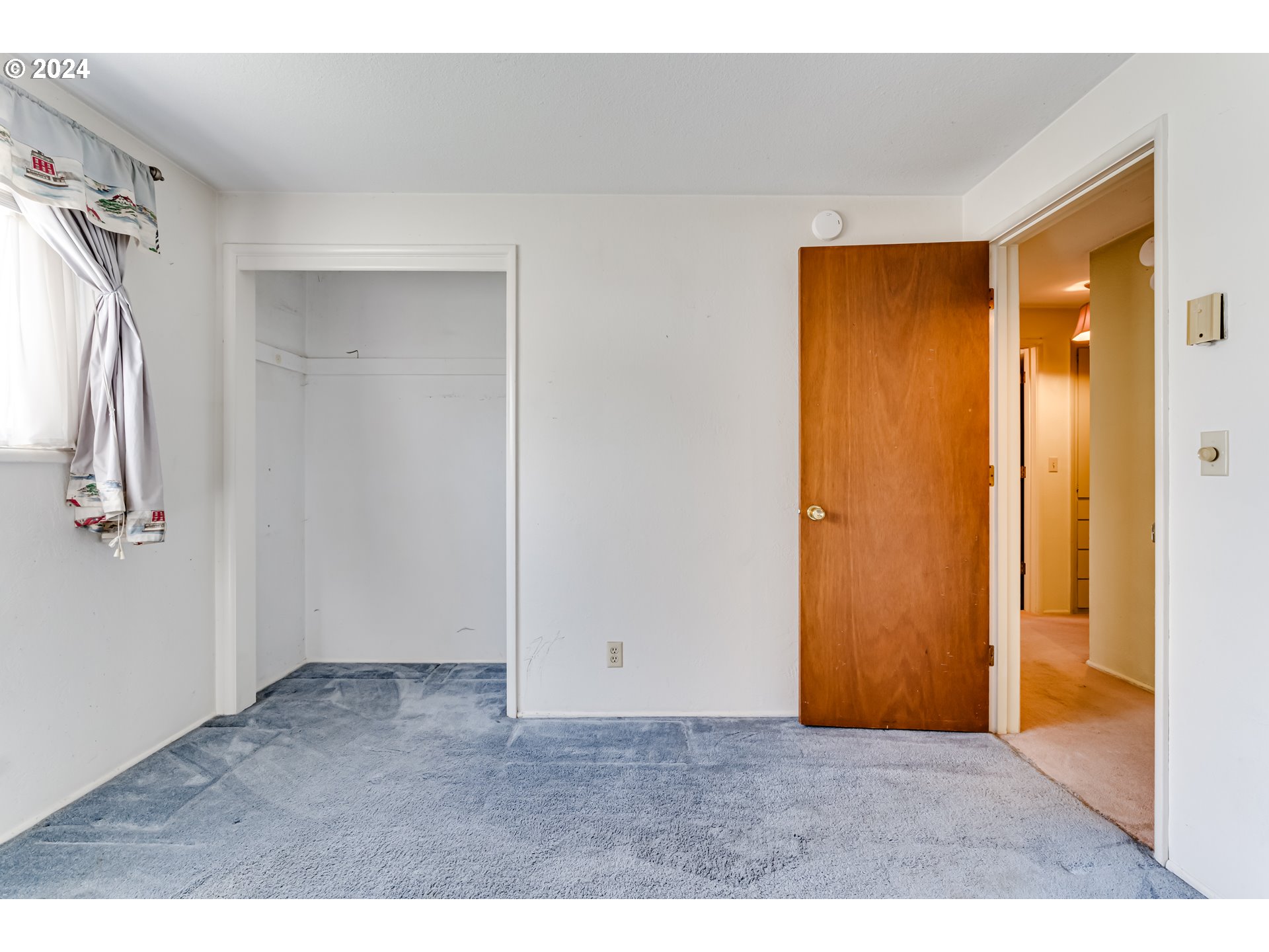 125 East 39th Place Eugene, OR 97405 - Photo 16 of 30 a view of an empty room with closet and a window