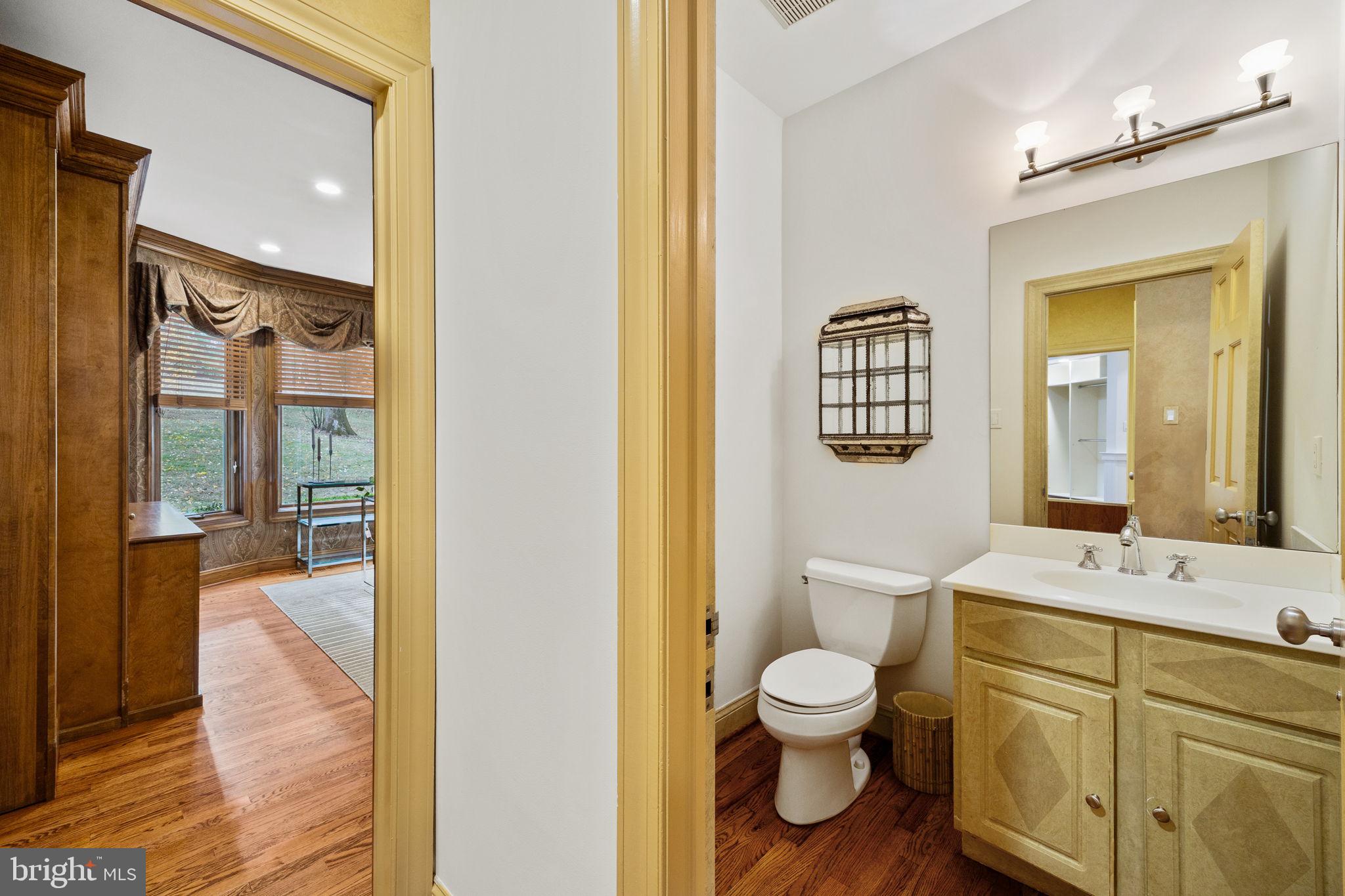 484 King Of Prussia Road Wayne, PA 19087 - Photo 25 of 98 a bathroom with a toilet a sink and a mirror