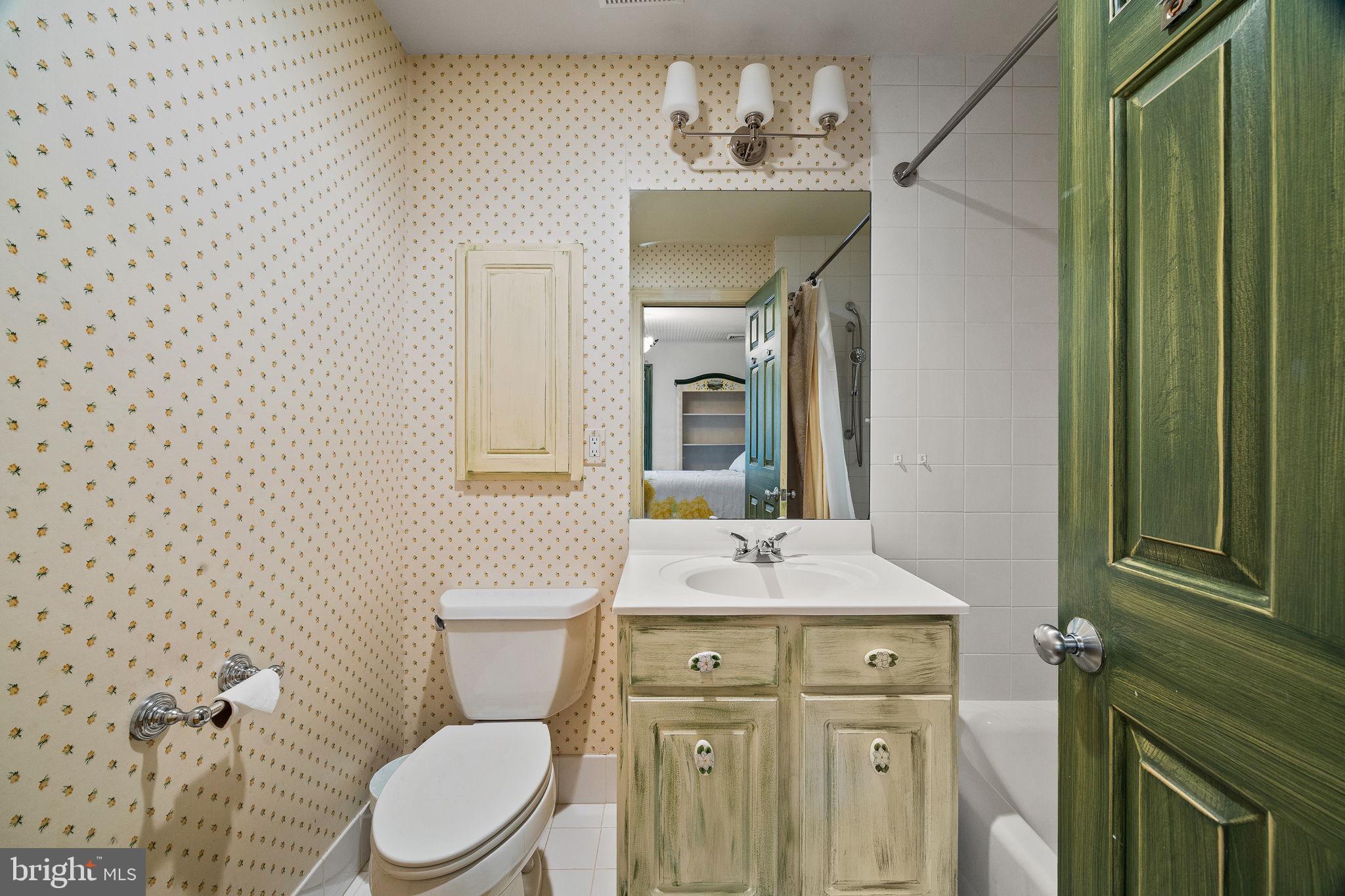 484 King Of Prussia Road Wayne, PA 19087 - Photo 38 of 98 a bathroom with a granite countertop toilet sink and mirror