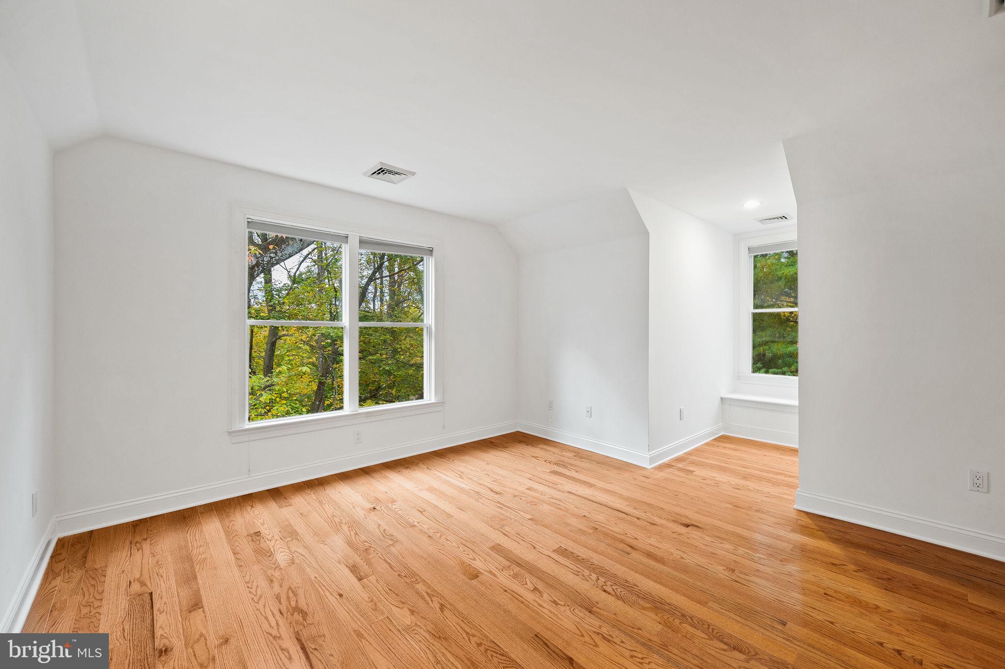 484 King Of Prussia Road Wayne, PA 19087 - Photo 44 of 98 a view of an empty room with wooden floor and a window