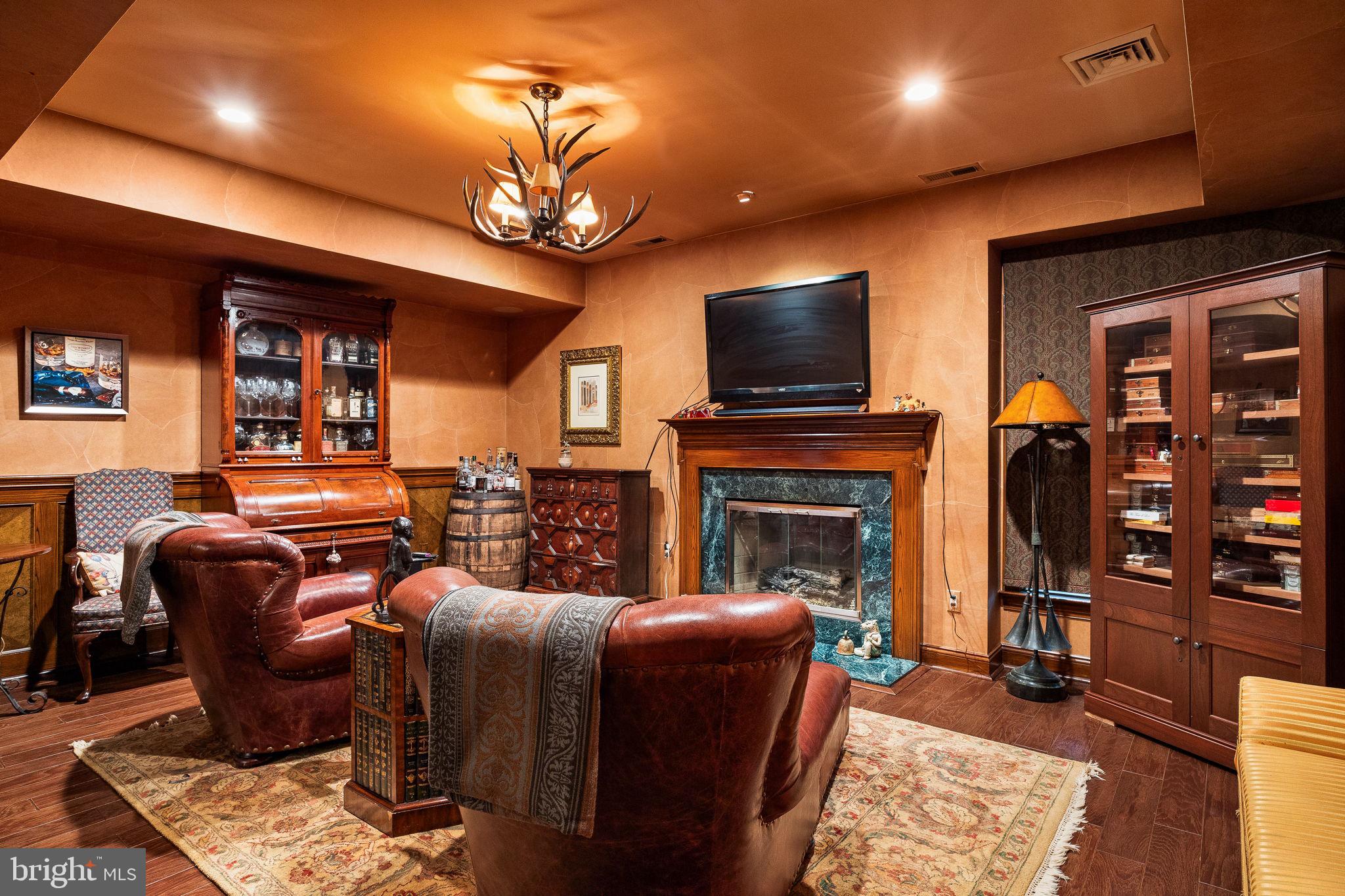 484 King Of Prussia Road Wayne, PA 19087 - Photo 57 of 98 a living room with furniture a flat screen tv and a fireplace