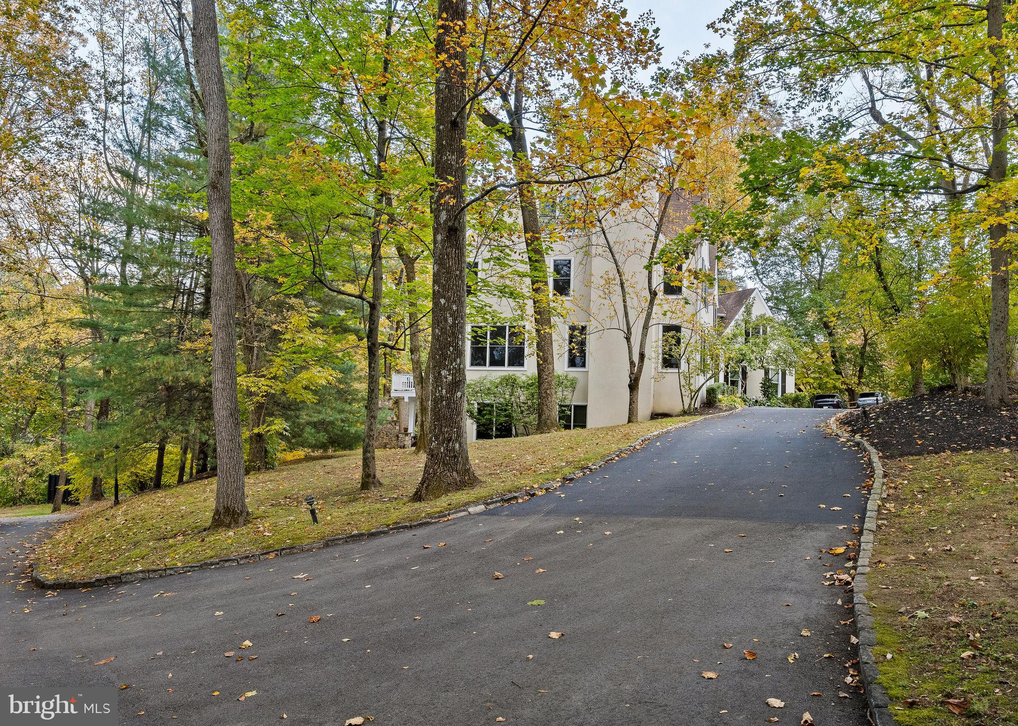 484 King Of Prussia Road Wayne, PA 19087 - Photo 62 of 98 a view of a house with large tree and wooden fence