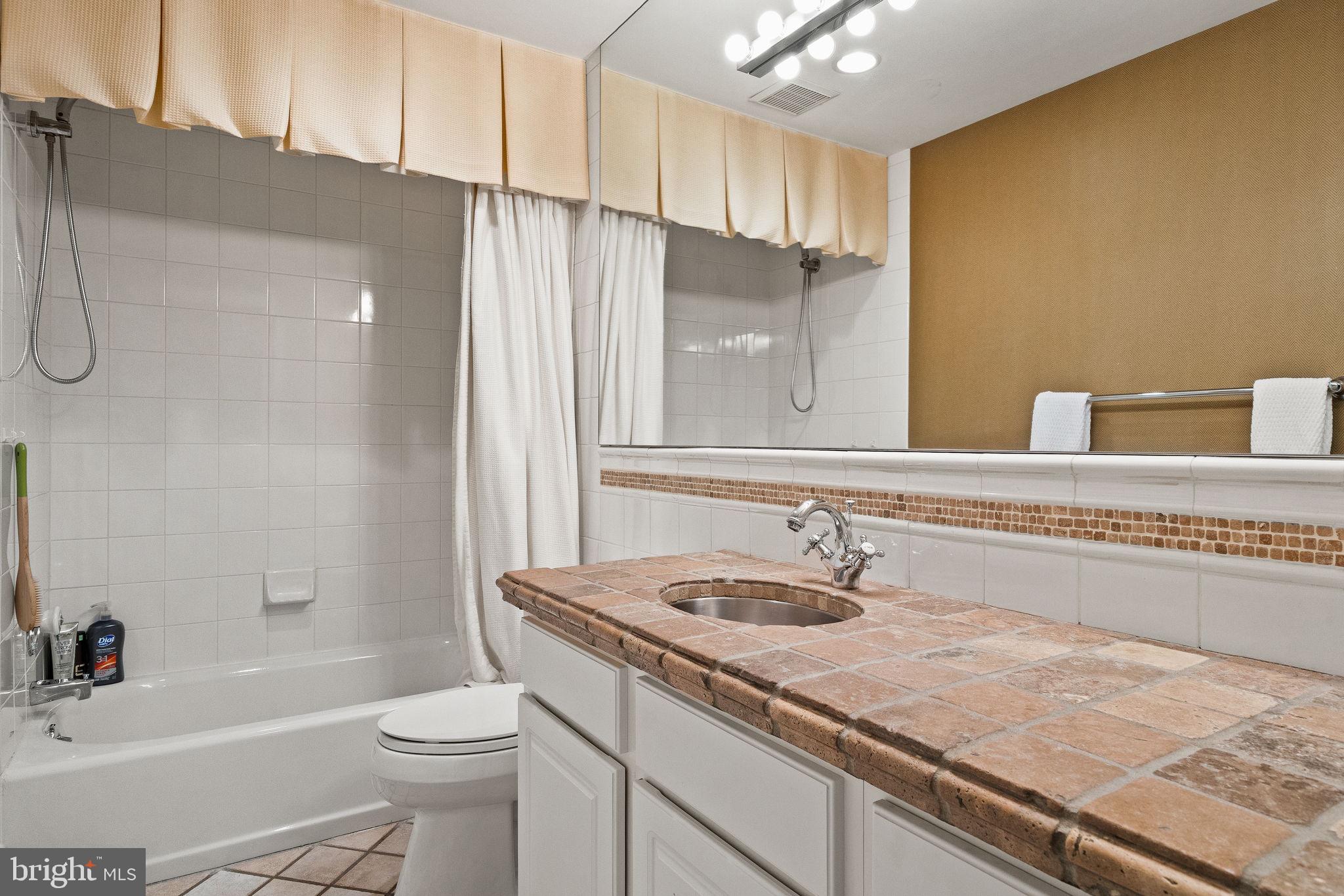 484 King Of Prussia Road Wayne, PA 19087 - Photo 63 of 98 a bathroom with a granite countertop sink toilet and shower