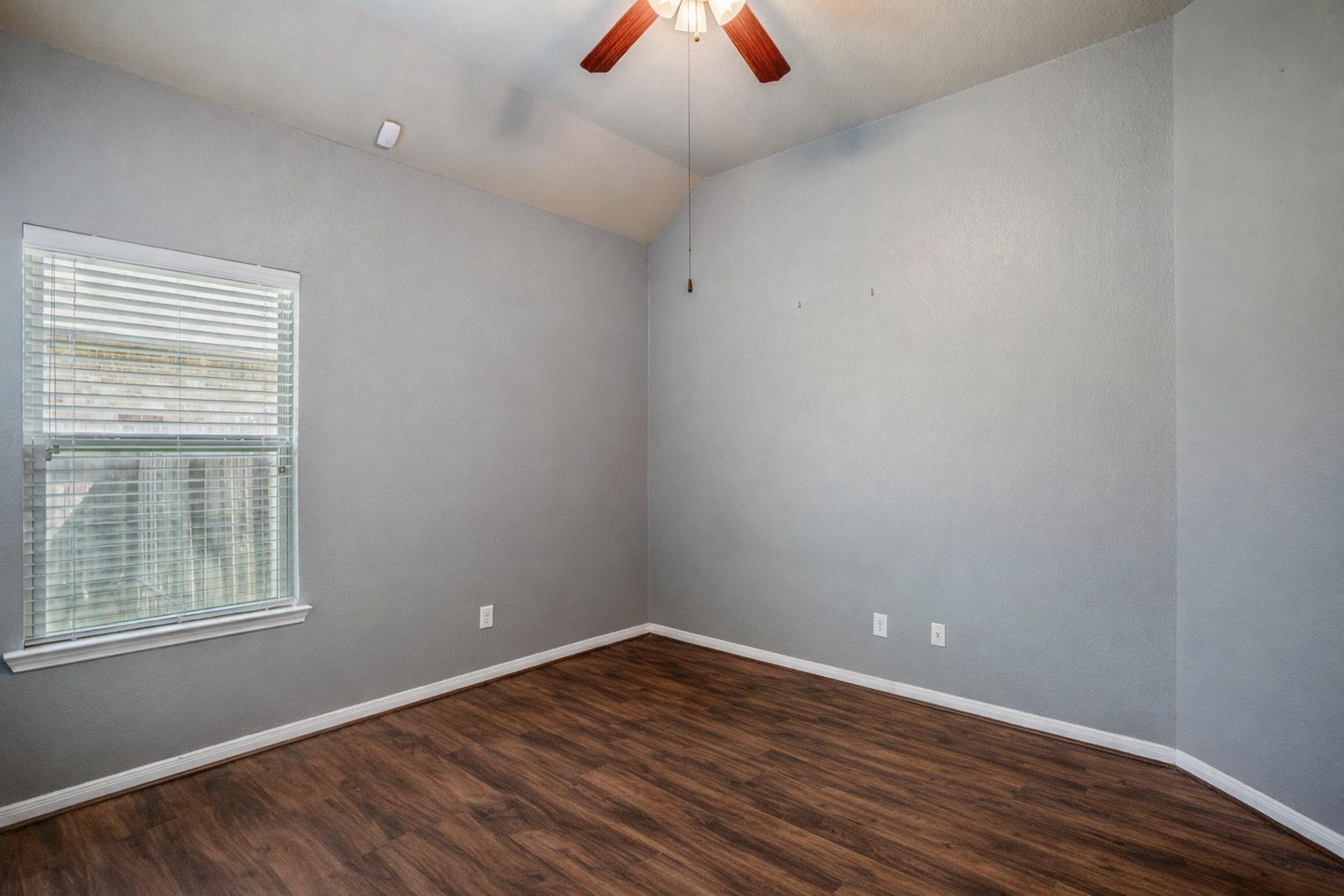 5319 Claymore Meadow Lane Spring, TX 77389 - Photo 26 of 34 wooden floor in an empty room with a window