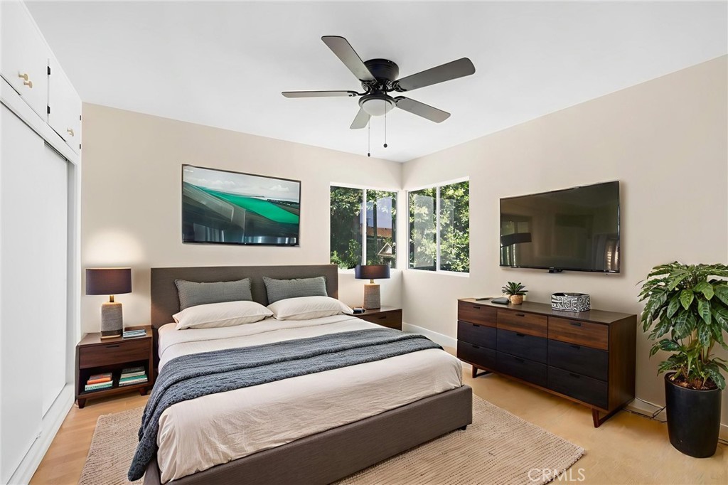 3020 East 3rd Street Long Beach, CA 90814 - Photo 12 of 63 a bedroom with a bed and a flat screen tv