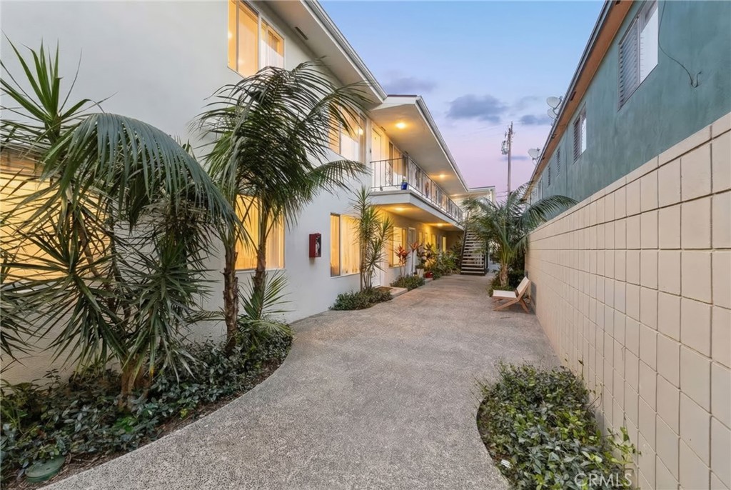 3020 East 3rd Street Long Beach, CA 90814 - Photo 2 of 63 a house with palm tree in front of it