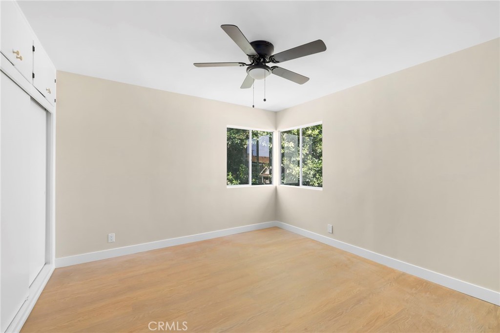 3020 East 3rd Street Long Beach, CA 90814 - Photo 34 of 63 an empty room with a window and a fan
