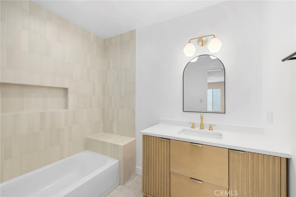 3020 East 3rd Street Long Beach, CA 90814 - Photo 38 of 63 a bathroom with a sink and a mirror