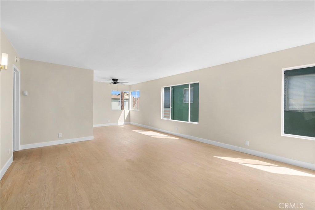 3020 East 3rd Street Long Beach, CA 90814 - Photo 39 of 63 a view of a big room with windows and chandelier fan