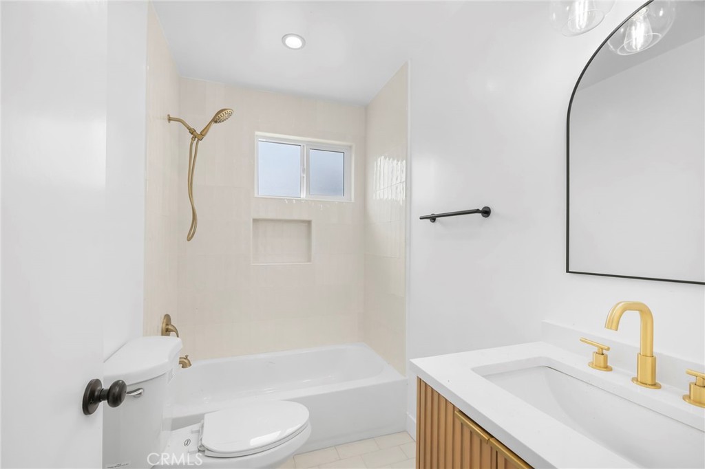 3020 East 3rd Street Long Beach, CA 90814 - Photo 46 of 63 a bathroom with a sink toilet and shower