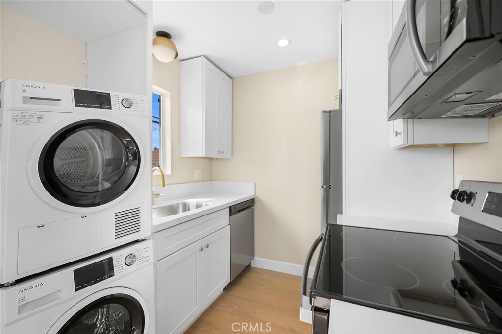 3020 East 3rd Street Long Beach, CA 90814 - Photo 48 of 63 a view of a kitchen with washer and dryer