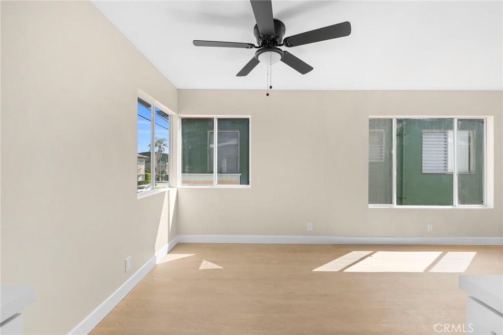 3020 East 3rd Street Long Beach, CA 90814 - Photo 51 of 63 an empty room with windows and fan