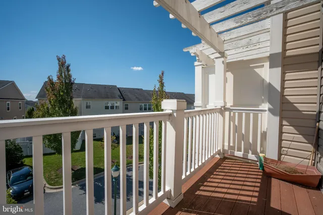 a view of a balcony with wooden floor