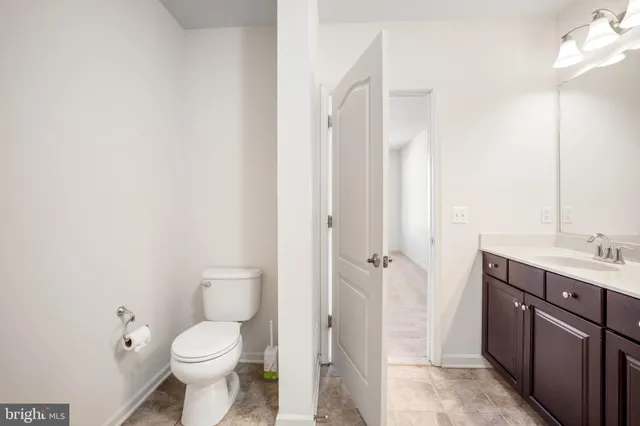a bathroom with a bathtub double vanity sink and a shower