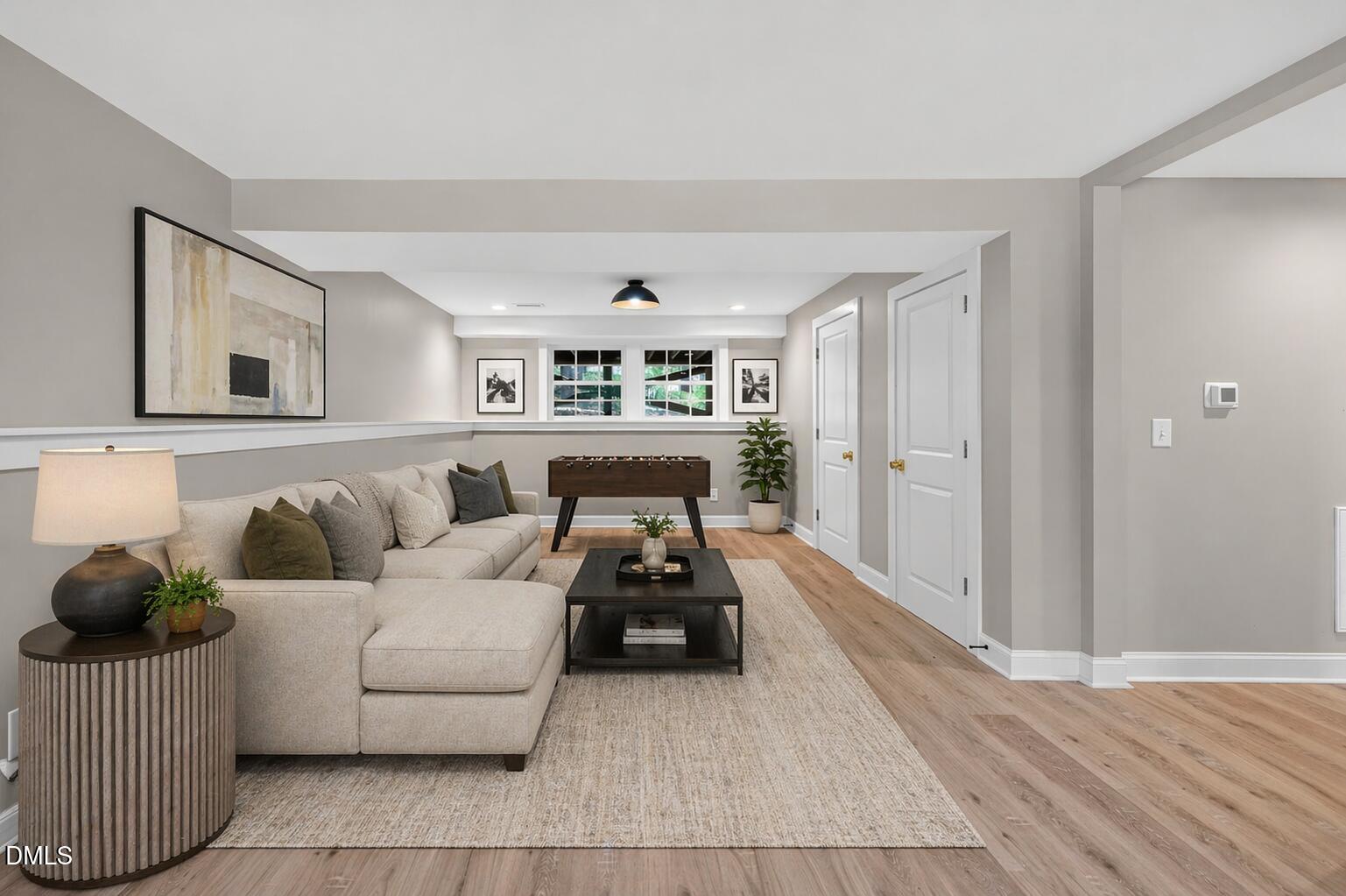313 Crown Oaks Drive Raleigh, NC 27615 - Photo 25 of 60 a living room with furniture and wooden floor
