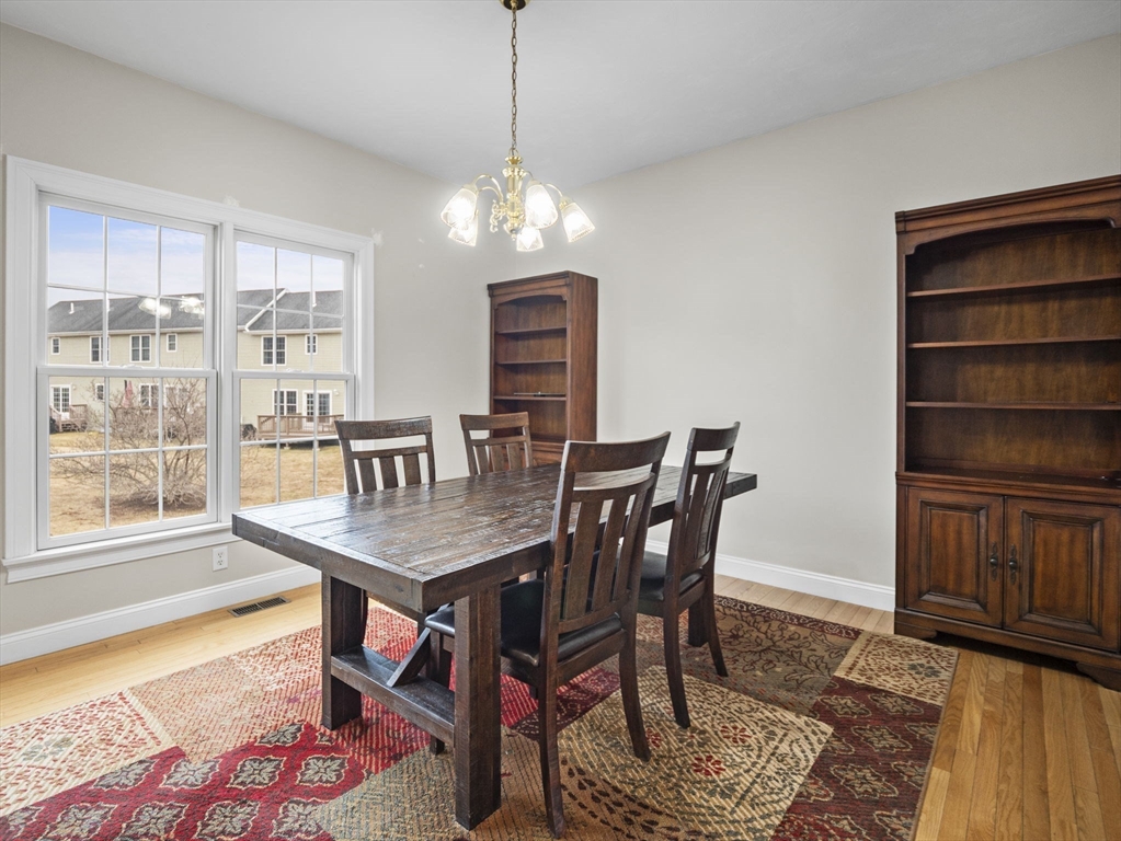36 Knowlton Circle, Unit 36 Upton, MA 01568 - Photo 13 of 39 a view of a dining room with furniture window and wooden floor
