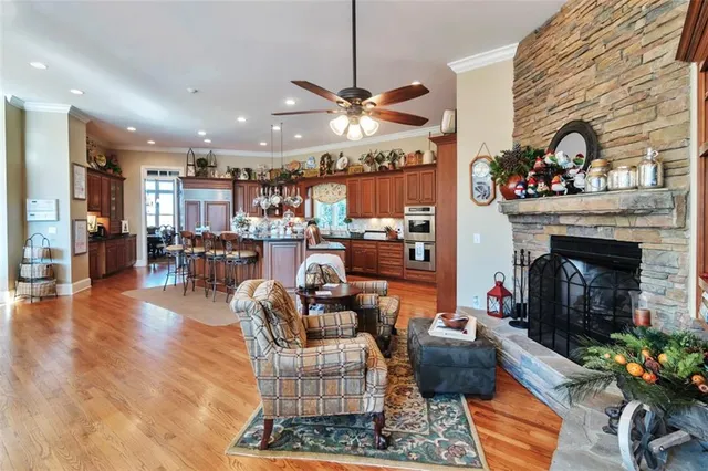 a kitchen filled with stainless steel appliances granite countertop a sink and stove