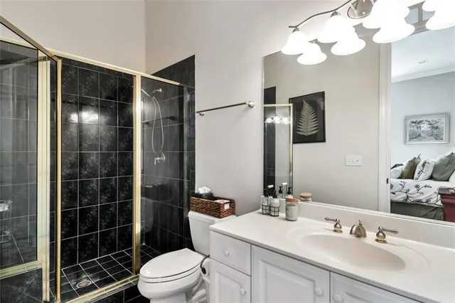 a bedroom with furniture and a wooden floor