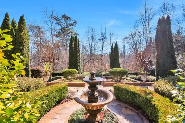 an aerial view of a house with yard and street view