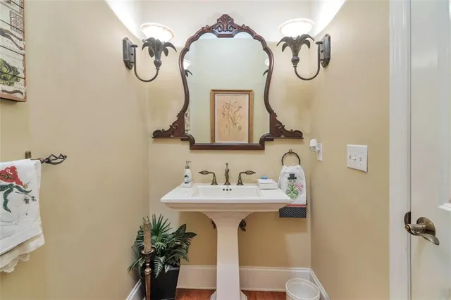 a living room with furniture fireplace and a large window