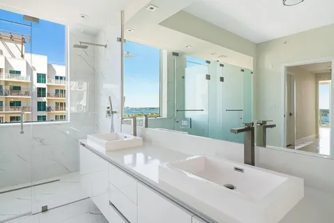 a bathroom with a sink and a large mirror