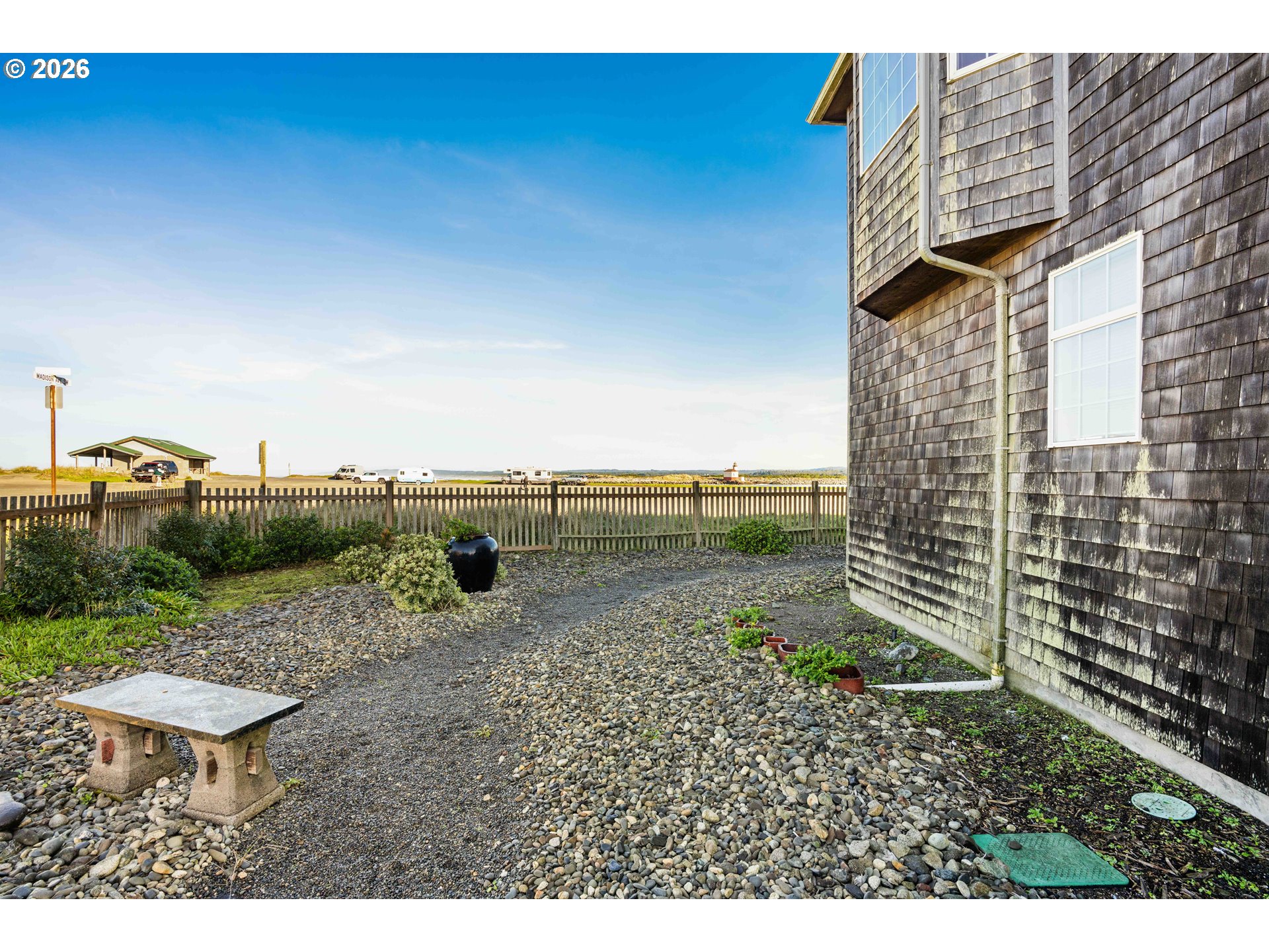 323 Madison Avenue Bandon, OR 97411 - Photo 11 of 43 a view of a pathway with a building in the background